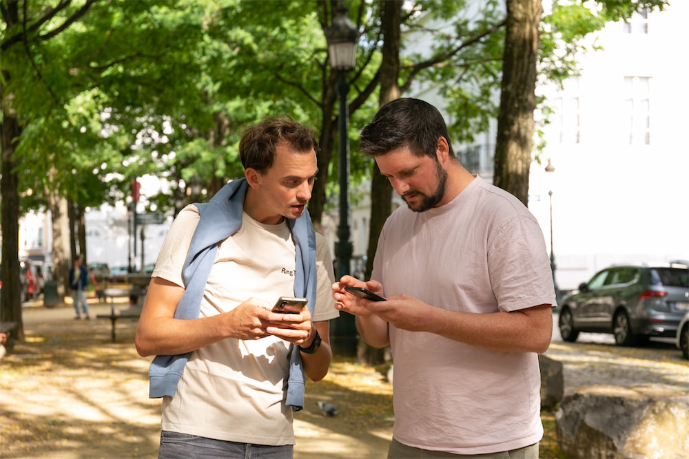 people playing a team building on their smartphone